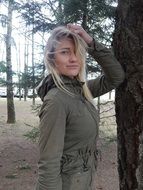 girl posing near a tree in the park
