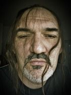 portrait of a mystical man with long hair