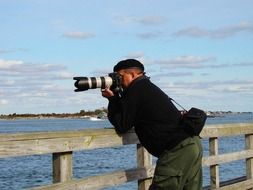 man photographer at the river