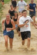runners competition in the mud