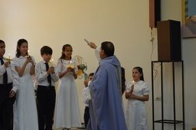 catholic priest celebrates mass
