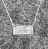 swing for children on a gray background