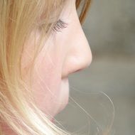 blond child girl face close up, profile