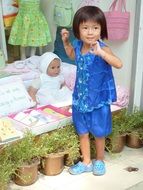 child in a doll shop