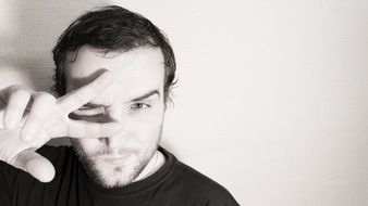 black and white photo of a young man in a pose