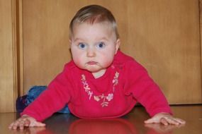 baby girl learns to crawl