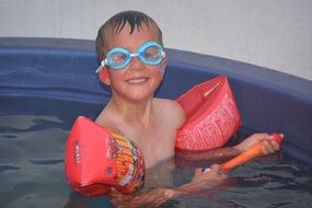 child in swimming outfit in the pool