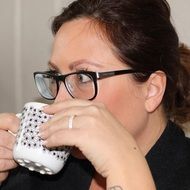 girl drinking from a Cup