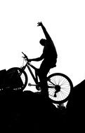silhouette of a man on a bicycle