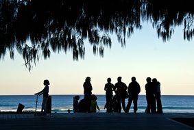 silhouettes of people on the ocean in Australia