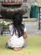 girl sitting at the altar