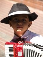 child in hat and with Bayan