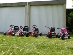 kettcar toys parked in the yard