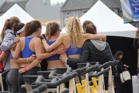 a group of women hugging each other