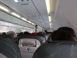 airplane salon with travelers
