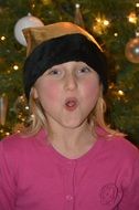 Gilr with the colorful Christmas hat