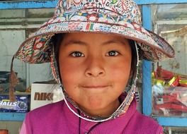 Peruvian girl in traditional hat close-up