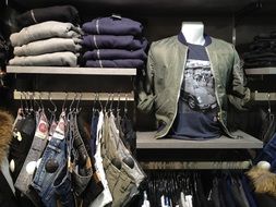 showcase with men's clothing in the store