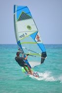 Windsurfer on the blue water of the ocean