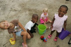 sweet nice kids playing on sand
