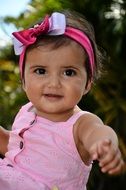 a girl named Linda in a pink dress