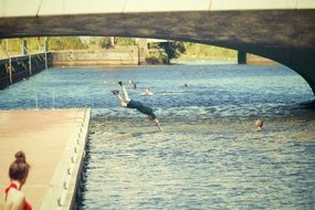 swim and dive under the city bridge