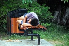 a man sleeps on a bench