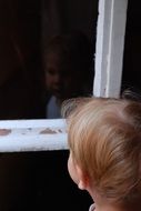 child by window