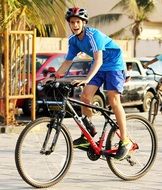 boy wearing a helmet rides a bicycle