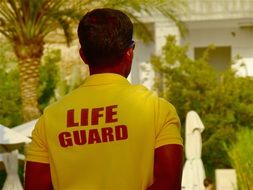 lifeguard in a yellow T-shirt