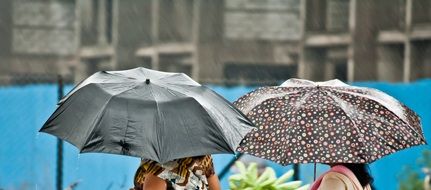 people under an umbrella in the rain