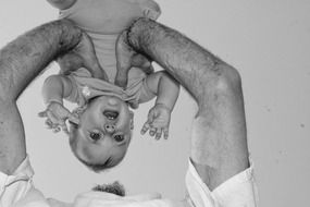 Black and white photo of the baby girl and father