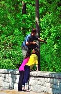 taking picture with camera in a park