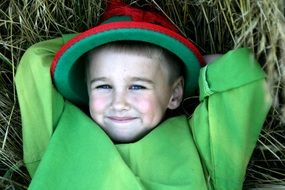 baby in a hat like a robin hood