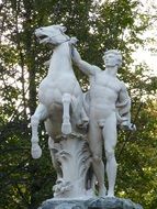 sculpture of a man and a horse in a park in Berlin