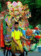 man with carnival decoration, indonesia, java, lumajang