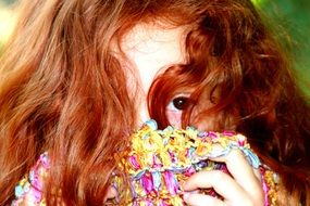red haired child girl hidding face, portrait