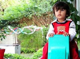 photo of a dreaming child in the garden