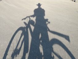 shadow of a man with a bicycle