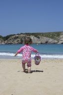 running baby on the beach