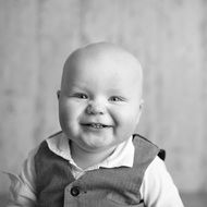 Black and white photo of the happy baby