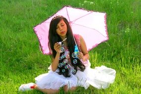photo of a girl in a princess dress with soap bubbles