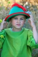 Child in a green hat of the Robin Hood