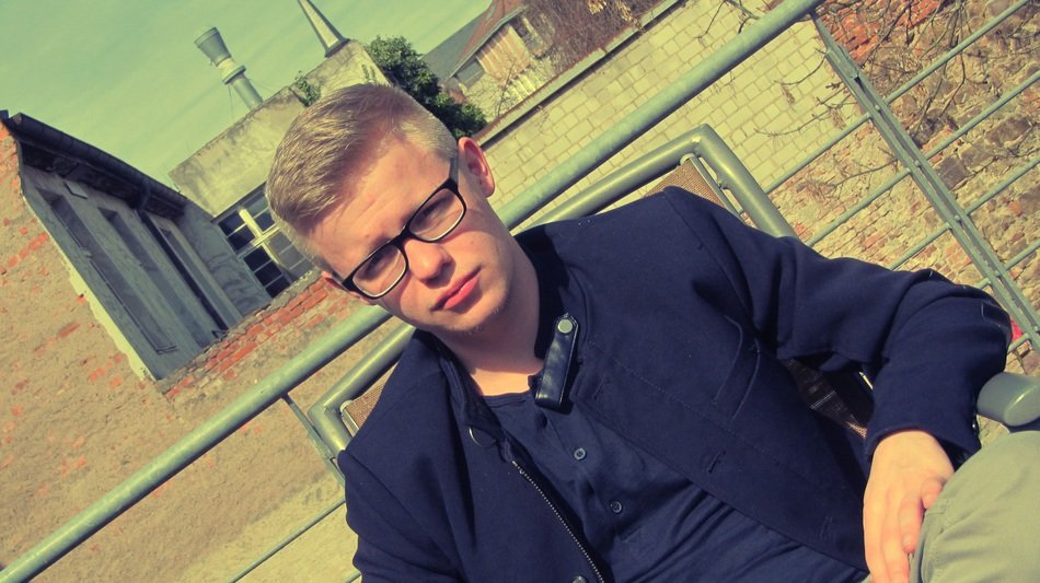 photo sudent in glasses on the balcony