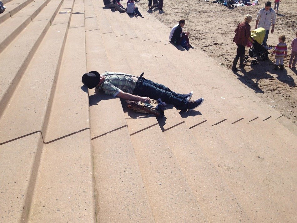 man sleeping on the stairs