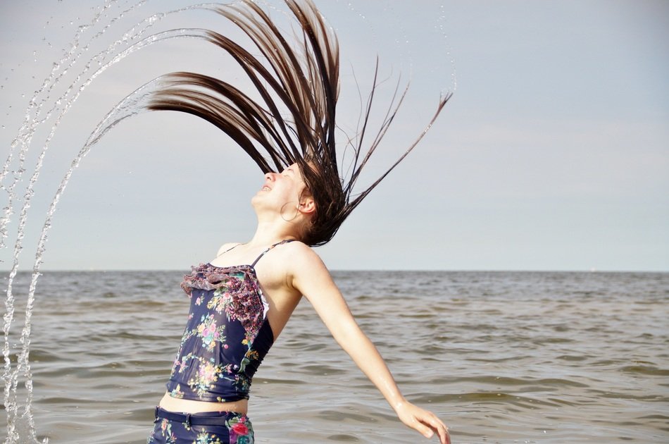 girl with wet hair on the shore