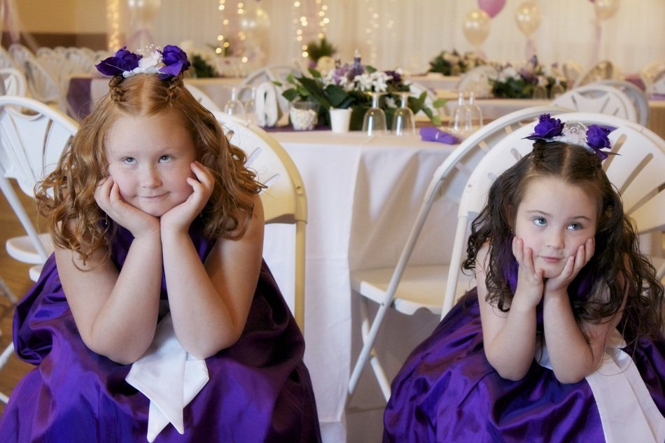 flowergirls, two cute sisters at wedding table