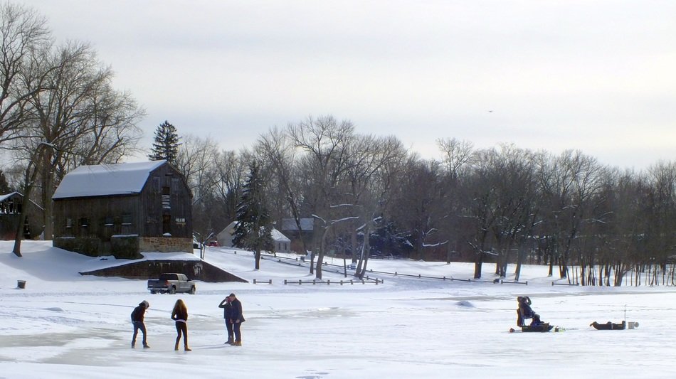 people on the winter pond