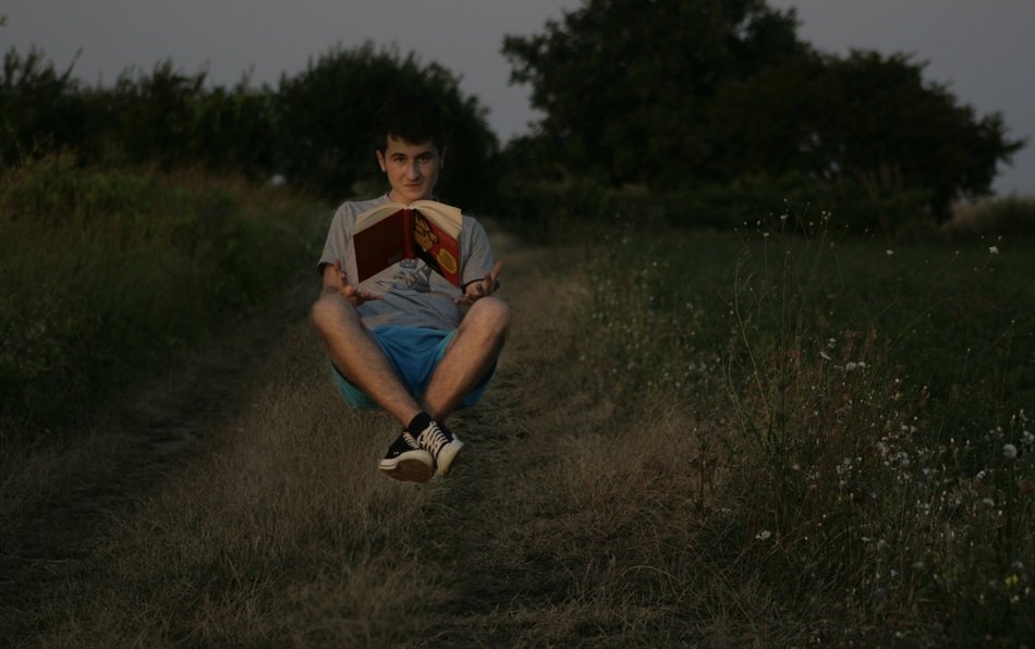 photo of the levitation of the boy and the book