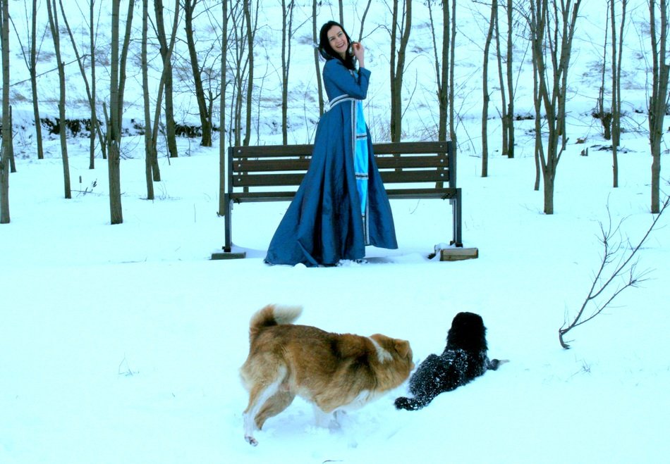 girl in blue dress near the bench